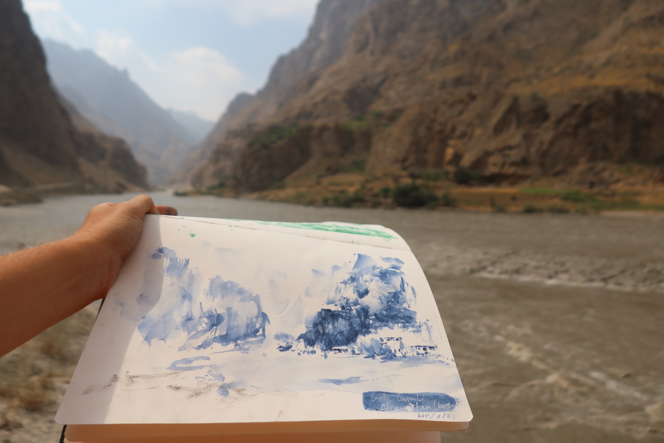 Lapis Lazuli Painting the Afghan landscape from the Tajik riverbank with genuine lapis lazuli.
